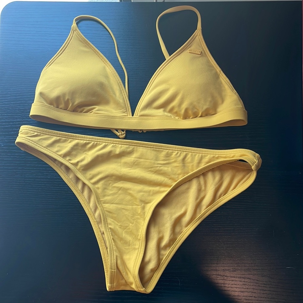 Yellow almost mustard color. Roxy bathing suit. Size Medium.